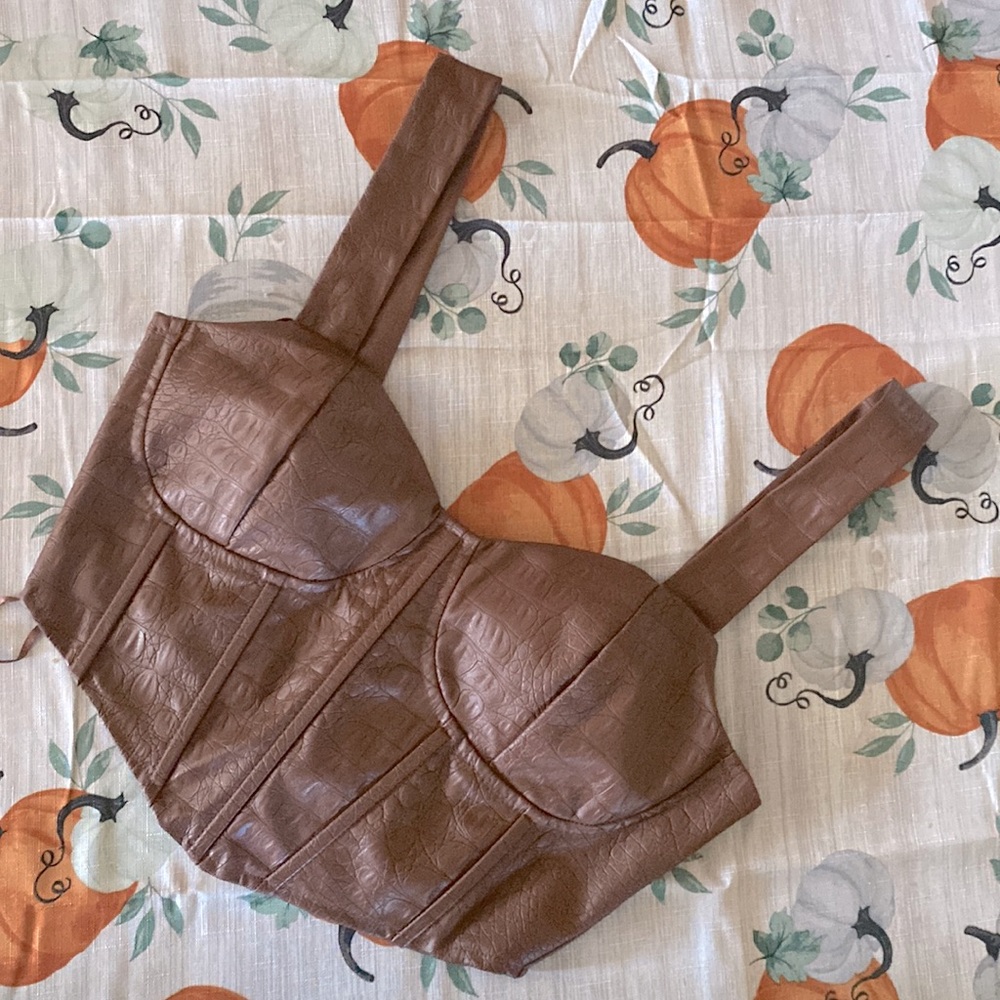Size Small  Brown/ Tan  O.L.M Leather like top! Super cute just too small!